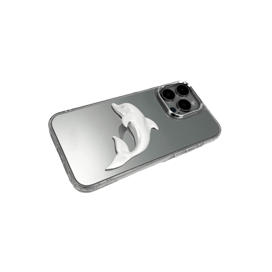Matte phone case with a high-relief sculpted dolphin figure swimming diagonally across the back.
