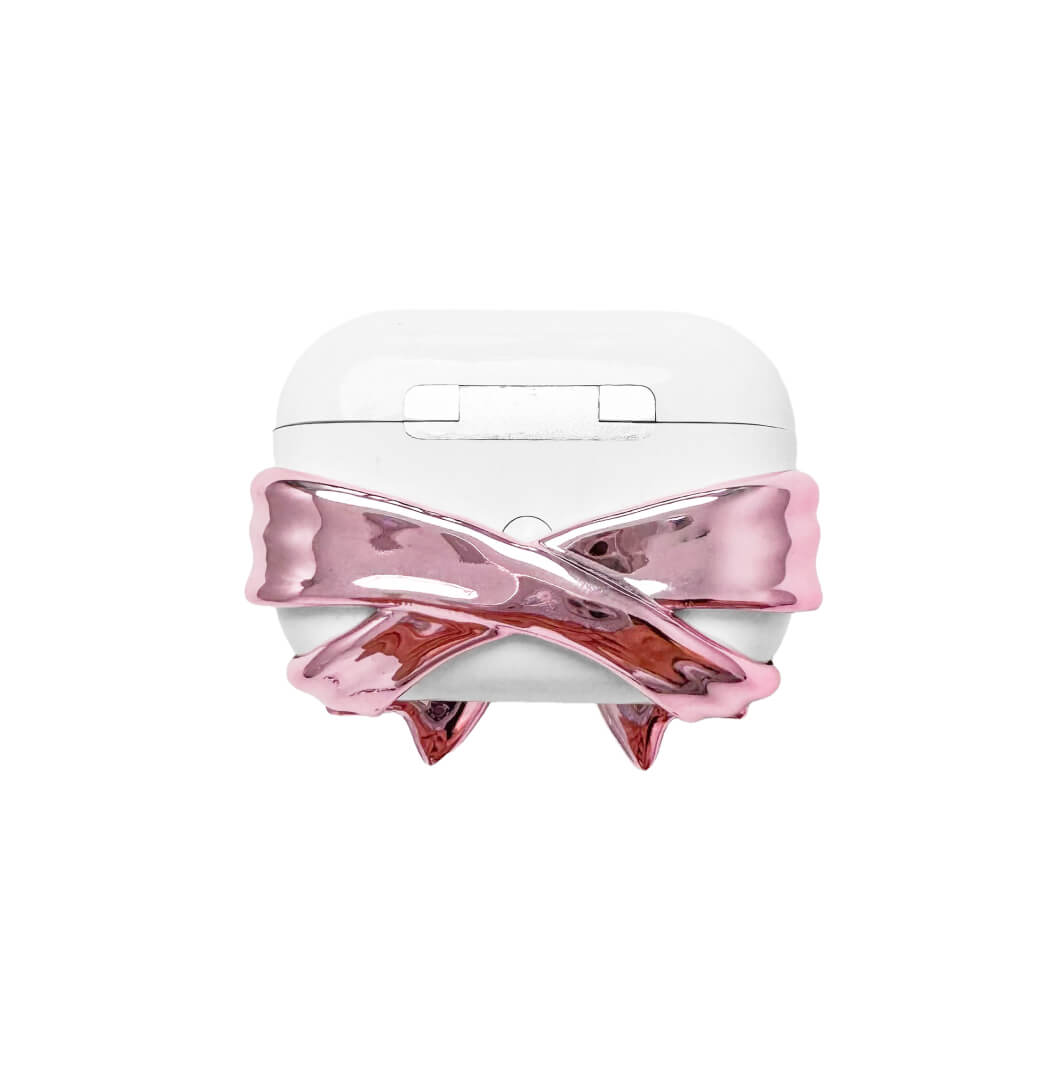 Bow Magic Bear AirPods Cover – Pink Edition featuring a beige gummy bear holding a pink crystal heart, centered on a metallic pink bow design.
