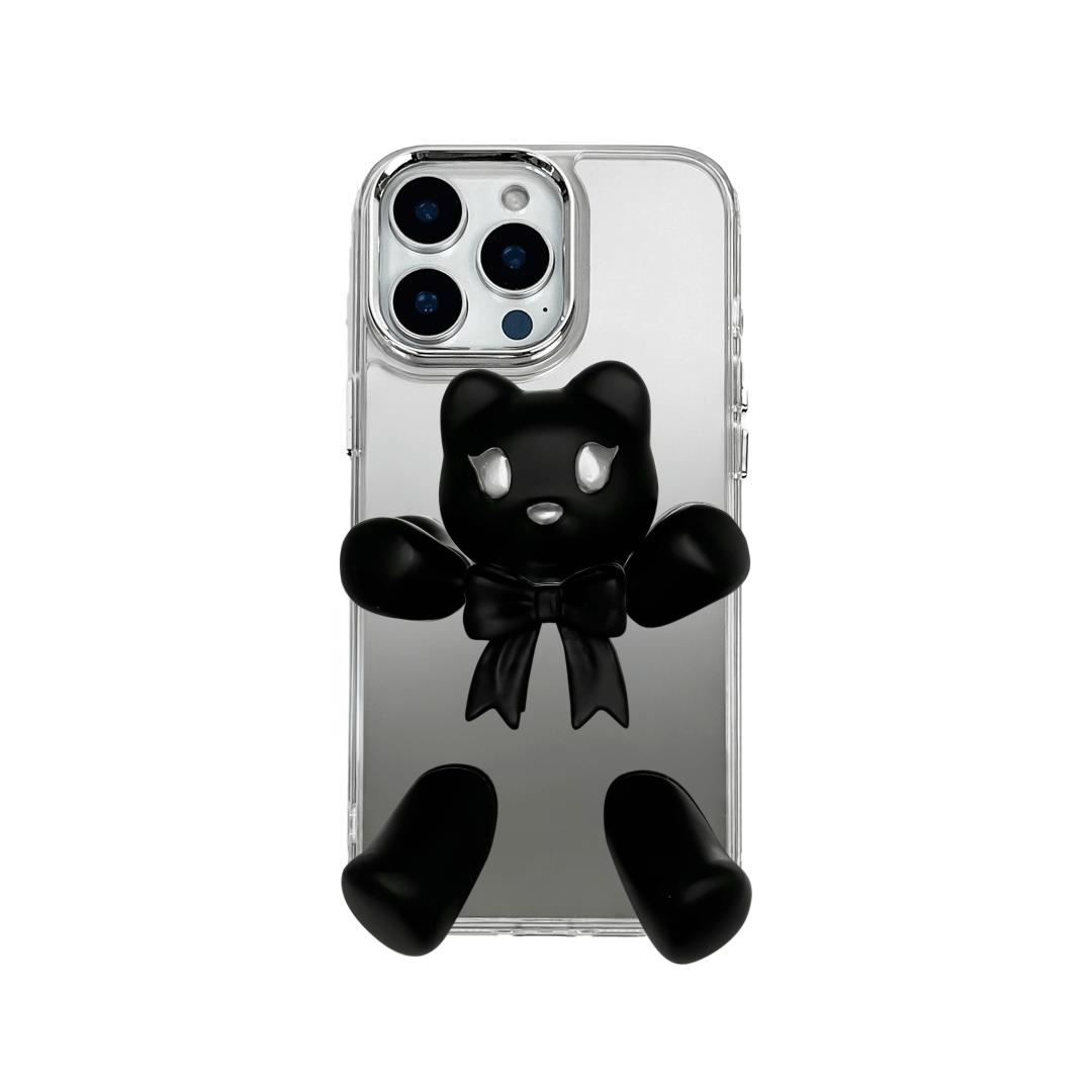 Transparent mirror phone case with a 3D teddy bear in brown flocking, wearing a black bow tie.