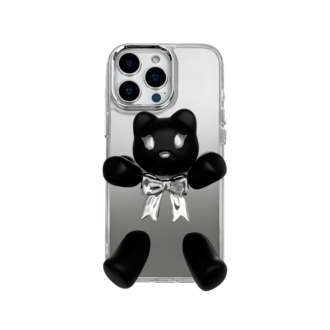 Transparent mirror phone case with a 3D teddy bear in brown flocking, wearing a black bow tie.