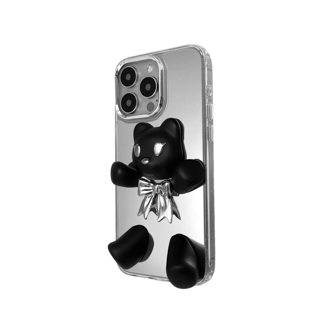 Transparent mirror phone case with a 3D teddy bear in brown flocking, wearing a black bow tie.
