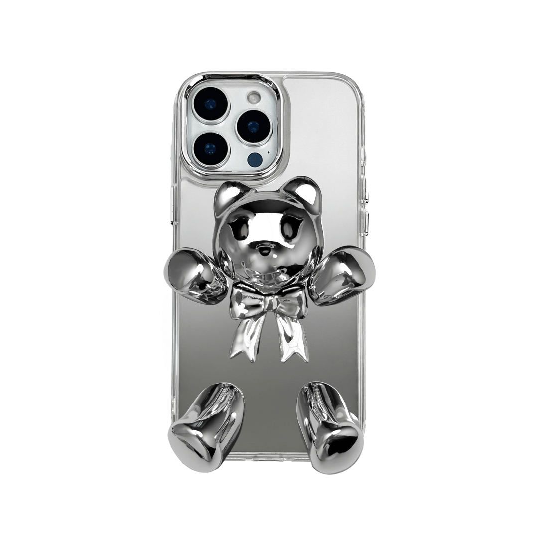 Transparent mirror phone case with a 3D teddy bear in brown flocking, wearing a black bow tie.