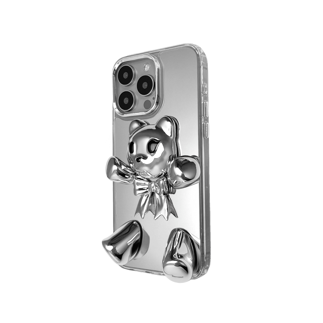 Transparent mirror phone case with a 3D teddy bear in brown flocking, wearing a black bow tie.