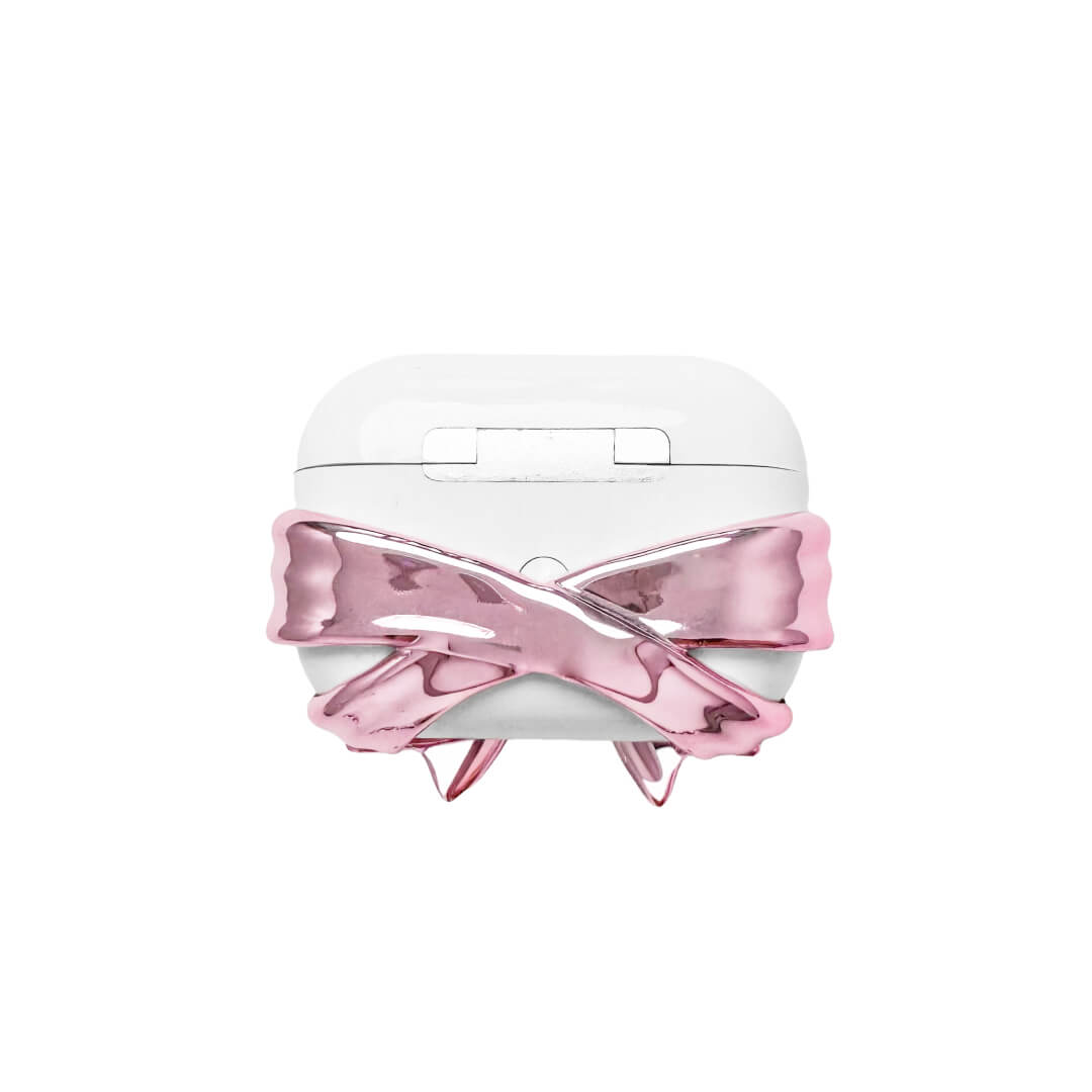 Bow Magic Bear AirPods Cover – Pink Edition featuring a beige gummy bear holding a pink crystal heart, centered on a metallic pink bow design.