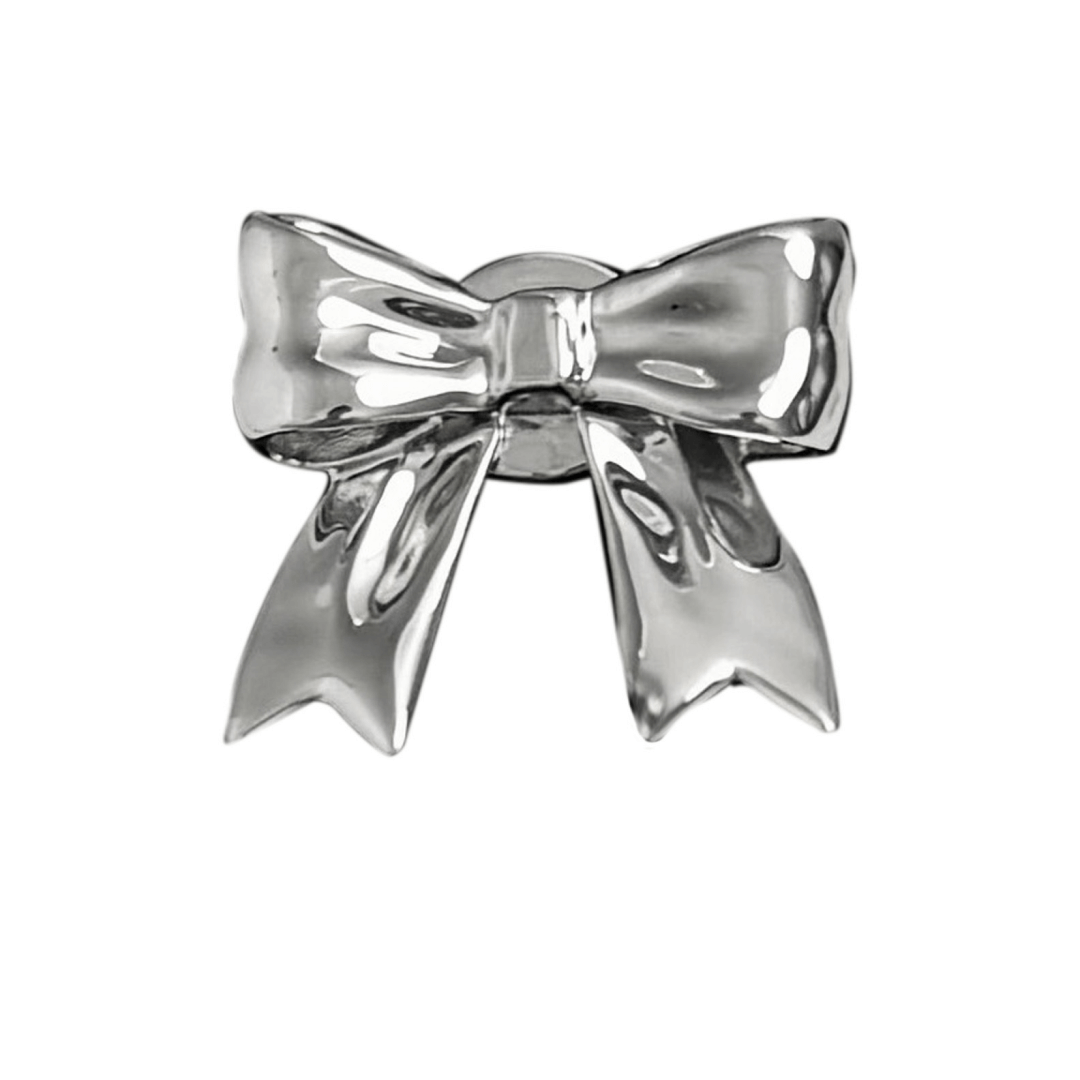A silver metallic bow knot shoelace charm with a polished finish, adding a stylish and elegant accent to sneakers.