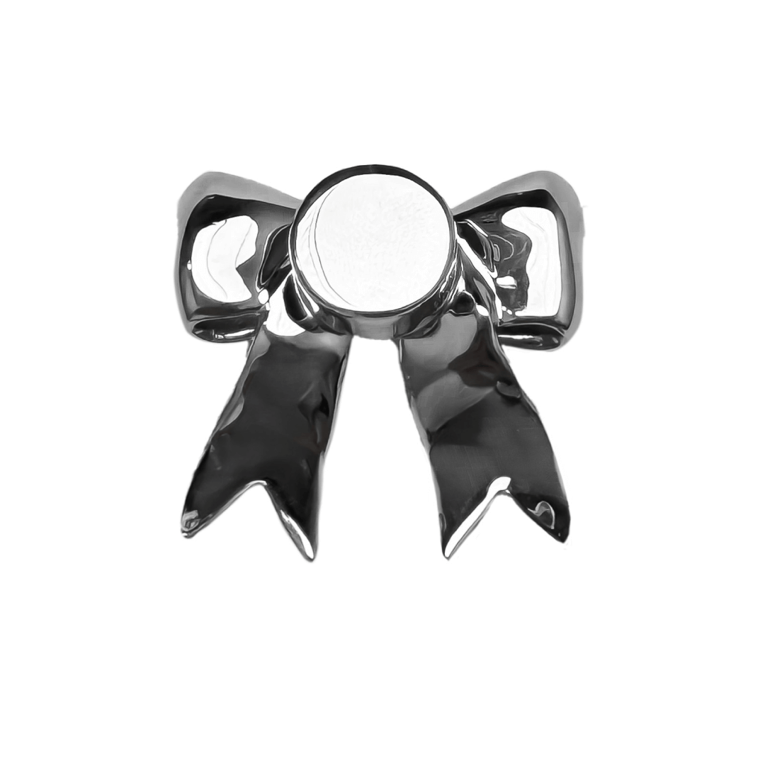 A silver metallic bow knot shoelace charm with a polished finish, adding a stylish and elegant accent to sneakers.