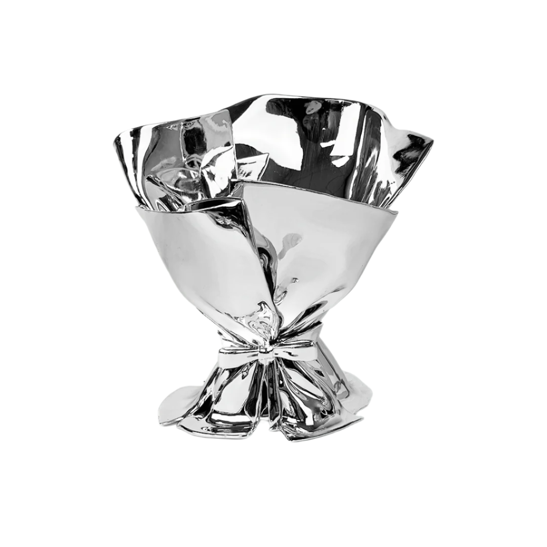 Futuristic chrome bouquet vase with sculptural ribbon tie – reflective metallic “petal” sheets gathered at the base, forming an abstract floral vessel