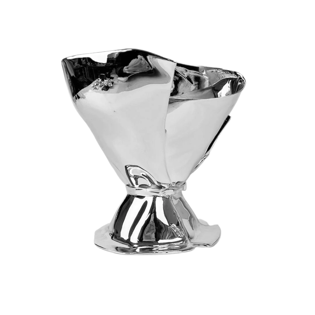 Futuristic chrome bouquet vase with sculptural ribbon tie – reflective metallic “petal” sheets gathered at the base, forming an abstract floral vessel