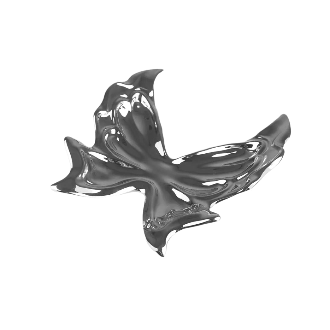 Futuristic chrome butterfly sculpture with fluid 3D wings – minimalist metal art piece featuring mirror-like surface and organic totemic form