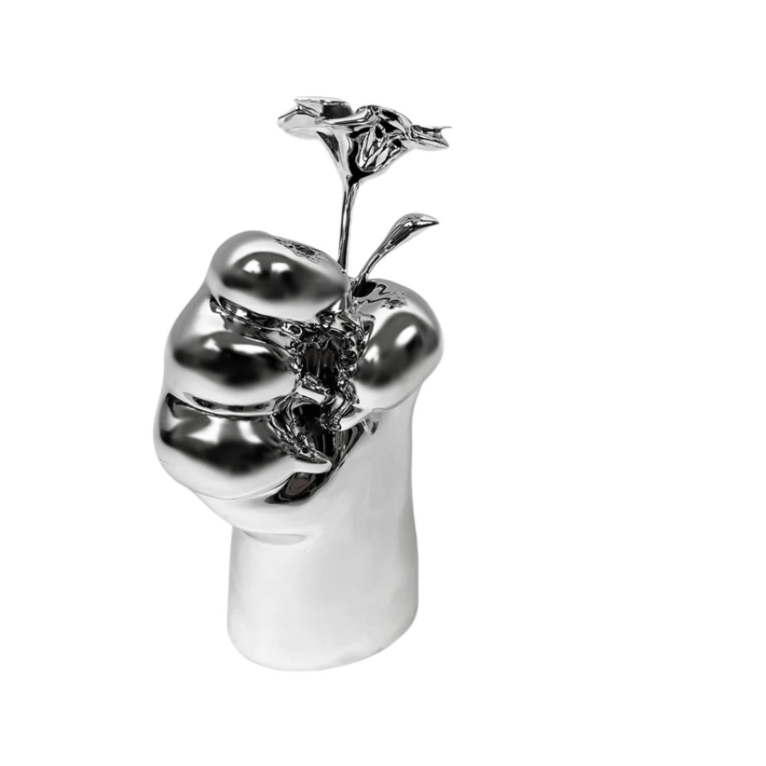 Futuristic chrome cat paw vase – sculptural paw-shaped metal vessel with smooth reflective finish, blending playful animal motif and minimalist design