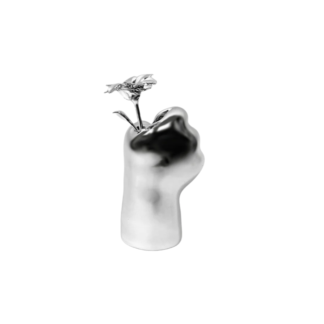Futuristic chrome cat paw vase – sculptural paw-shaped metal vessel with smooth reflective finish, blending playful animal motif and minimalist design