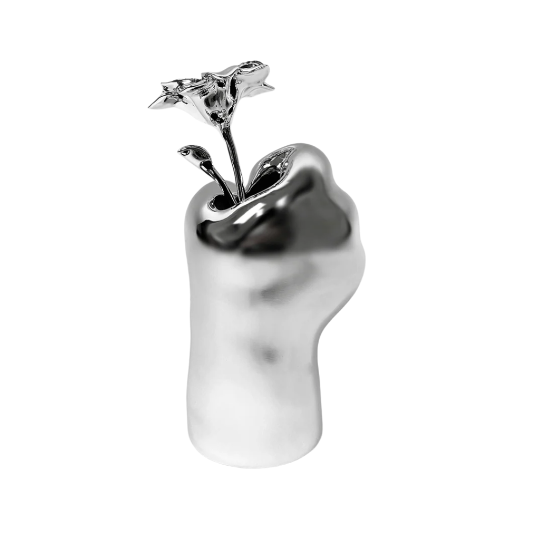 Futuristic chrome cat paw vase – sculptural paw-shaped metal vessel with smooth reflective finish, blending playful animal motif and minimalist design