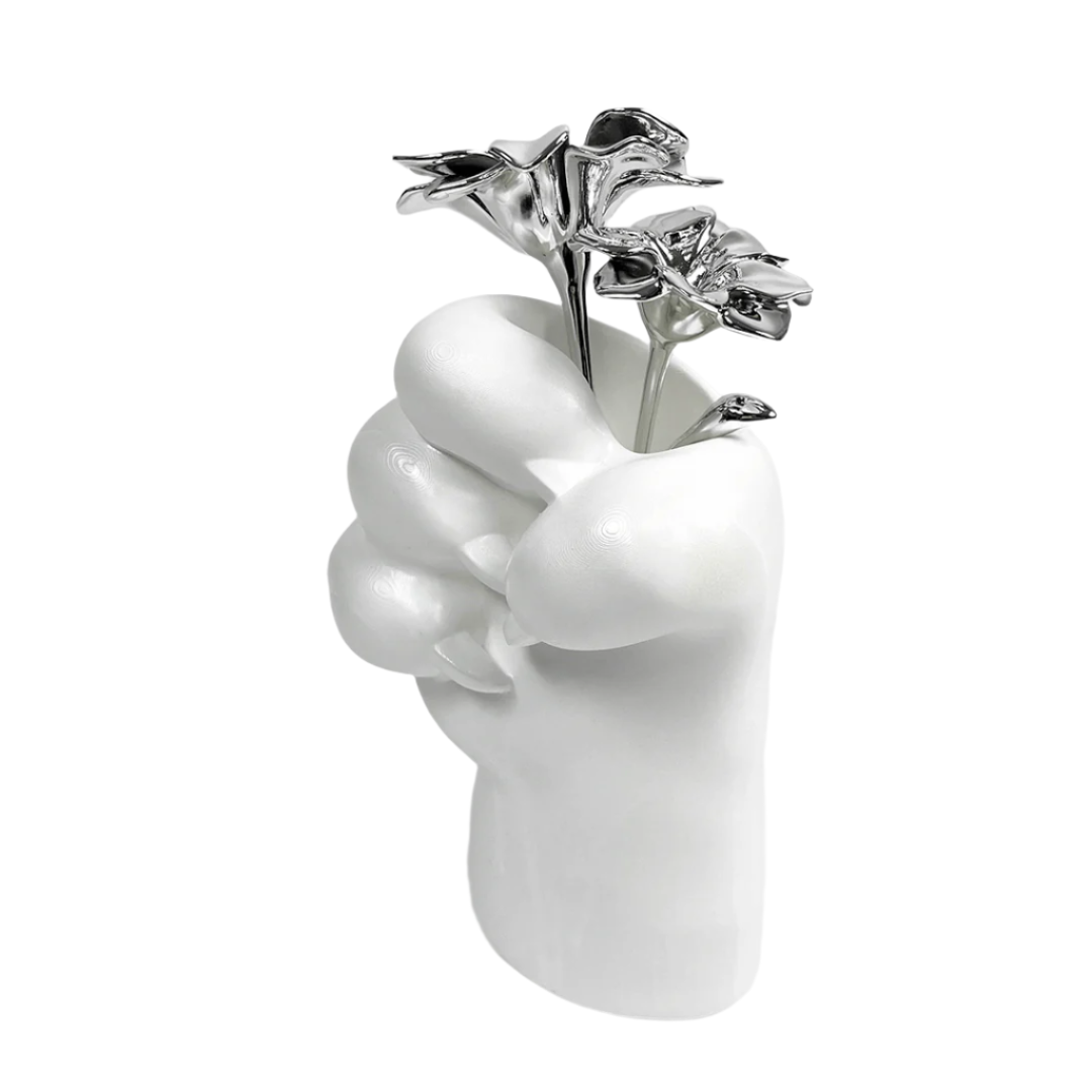 Futuristic chrome cat paw vase – sculptural paw-shaped metal vessel with smooth reflective finish, blending playful animal motif and minimalist design