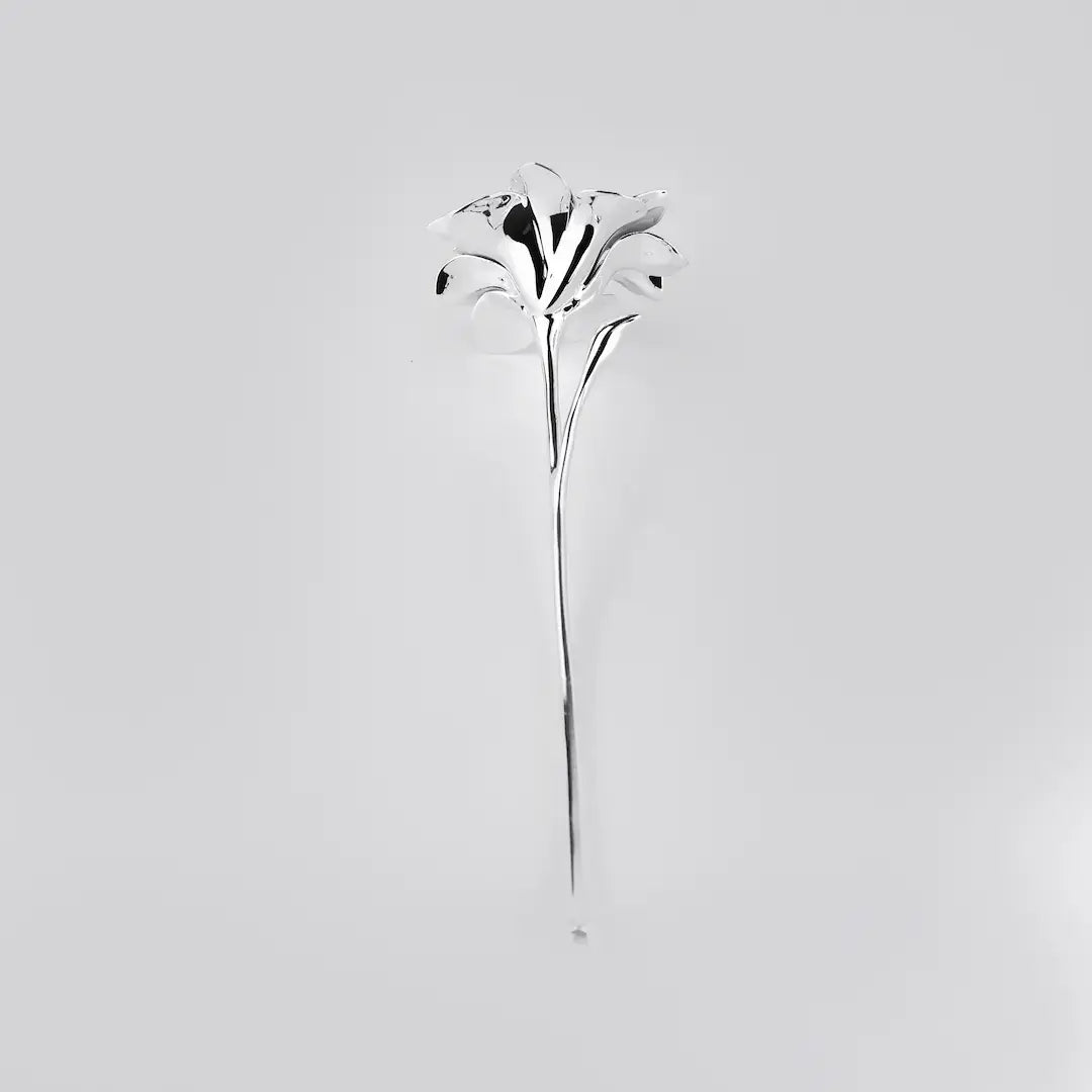 Futuristic chrome flower sculpture with fluid 3D petals – metallic botanical design in minimalist stem form
