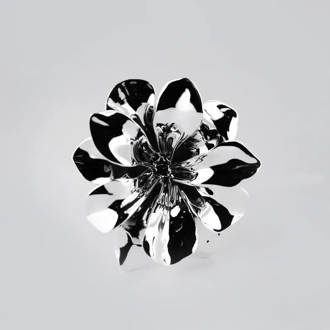 Futuristic chrome flower sculpture with fluid 3D petals – metallic botanical design in minimalist stem form