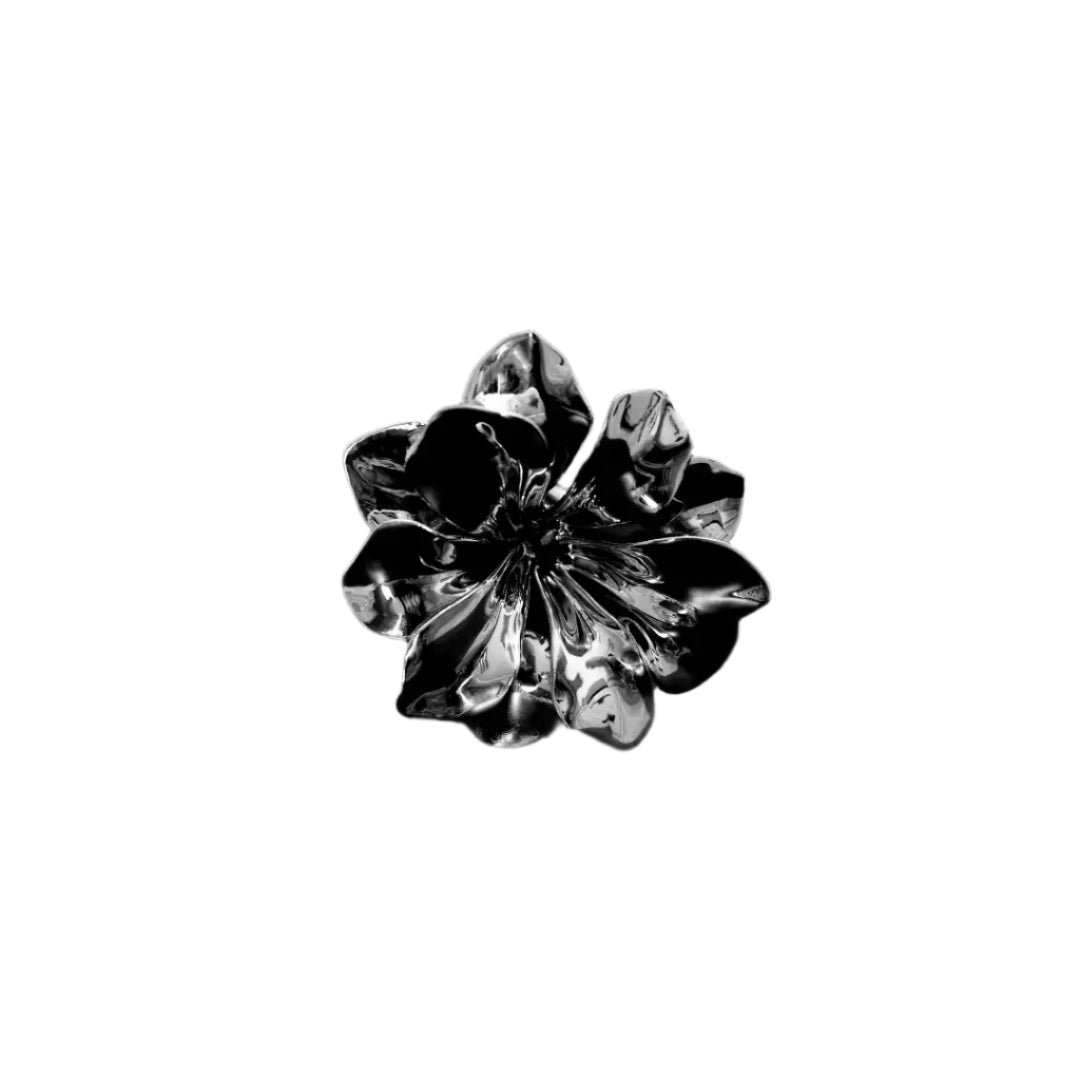 Futuristic chrome flower sculpture with fluid 3D petals – metallic botanical design in minimalist stem form