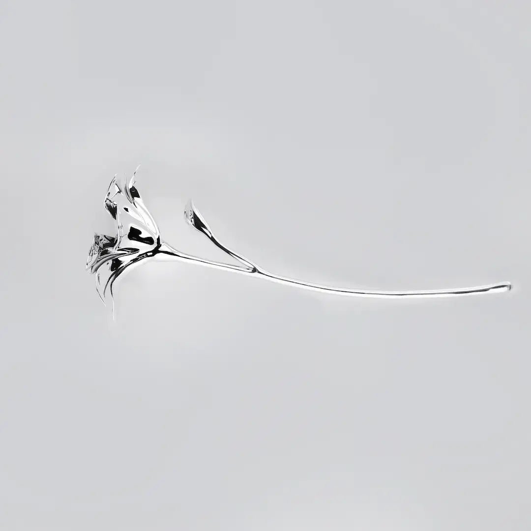 Futuristic chrome flower sculpture with fluid 3D petals – metallic botanical design in minimalist stem form