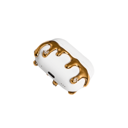 AirPods case with silver molten drip design and embedded crystals, resembling melted metal frozen mid-flow for a luxe, futuristic look.