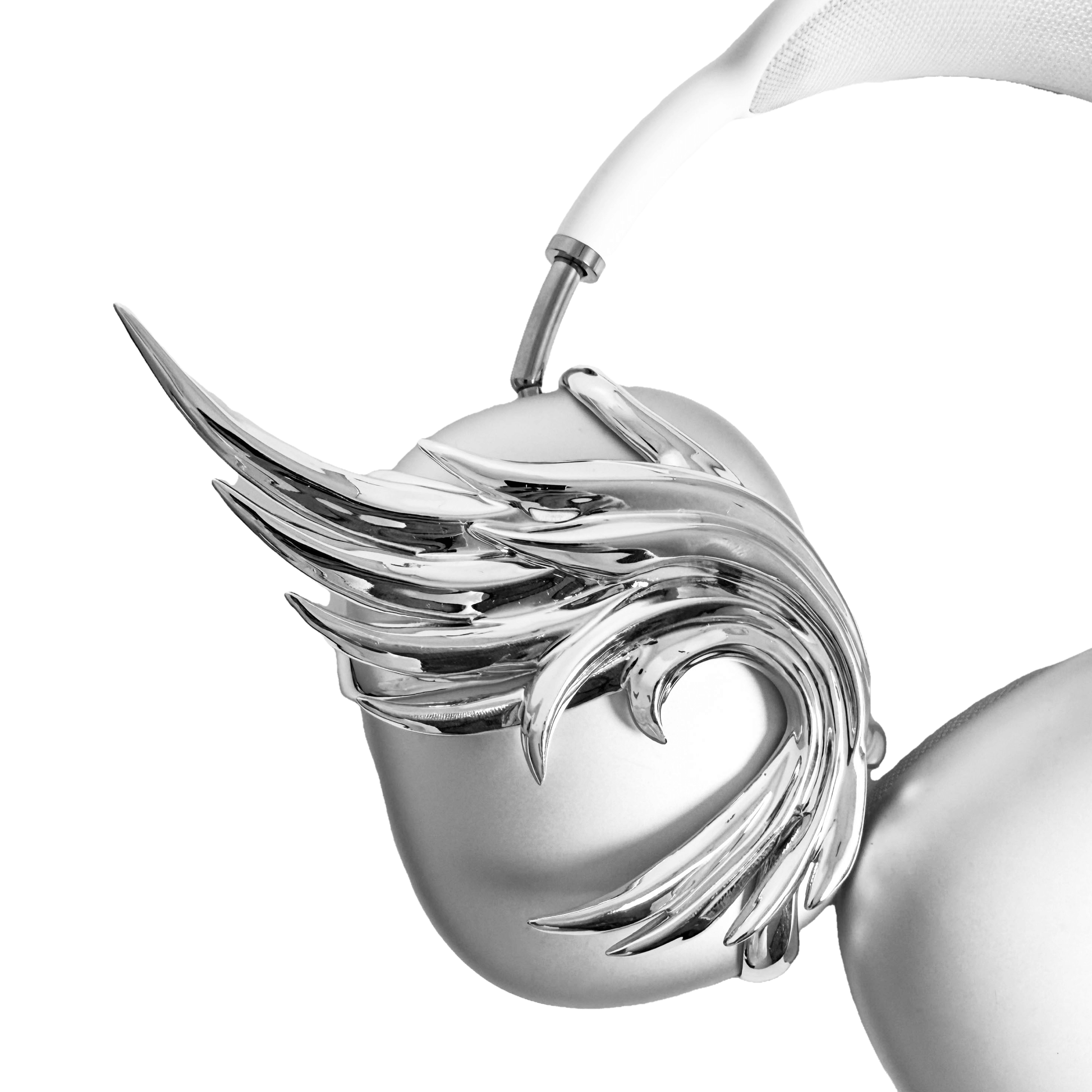 A sculptural 3D attachment for AirPods Max headphones featuring unique, upward-curled angel wings with layered feather details. Available in two finishes: Reflective Silver Chrome and Matte Ethereal White. Shown in both single ear cup and symmetrical pair configurations.
