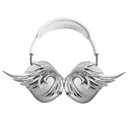 A sculptural 3D attachment for AirPods Max headphones featuring unique, upward-curled angel wings with layered feather details. Available in two finishes: Reflective Silver Chrome and Matte Ethereal White. Shown in both single ear cup and symmetrical pair configurations.