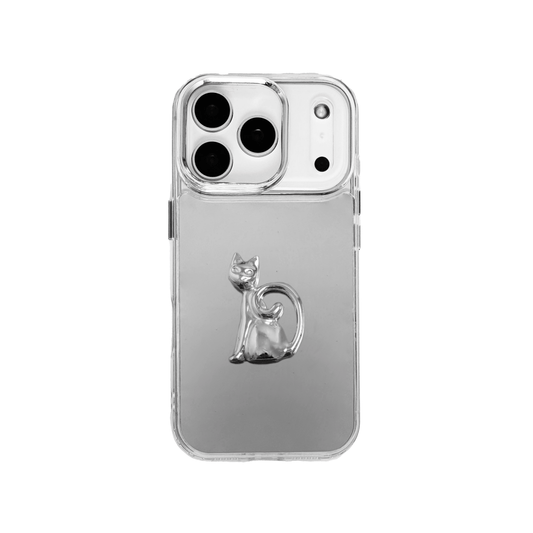 A premium iPhone case featuring a 3D sculpted sitting cat with an elegantly curled tail in a reflective silver chrome finish. Available in two variations: a high-shine Reflective Silver base and a sophisticated Sleek Black base, showcasing the poised and artistic feline silhouette.