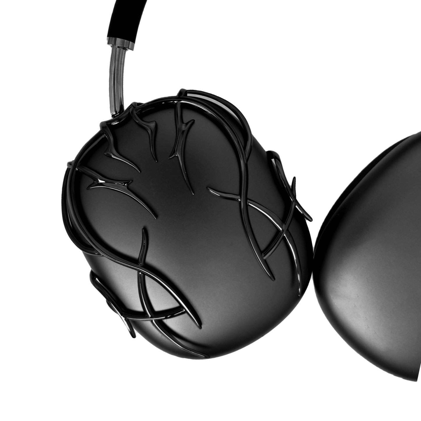 The XTENDED iDENTiTY "Cyber-Dreams" AirPods Max Cover from the Cyber Dream series. The black earcups are protected by a metallic, interwoven exoskeleton structure. The design showcases fluid, multi-layered lines forming a protective, woven mesh. Available finishes include Shadow Black, Liquid Silver, and Molten Gold.