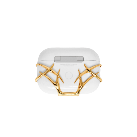 The XTENDED iDENTiTY Cyber Thorn AirPods Cover, a collection showcasing a fractal-like, aggressive metallic exoskeleton structure that fully encases the AirPods case. Available finishes include Shadow Black, Liquid Silver, and Molten Gold, all emphasizing the sharp, futuristic, protective armor design.