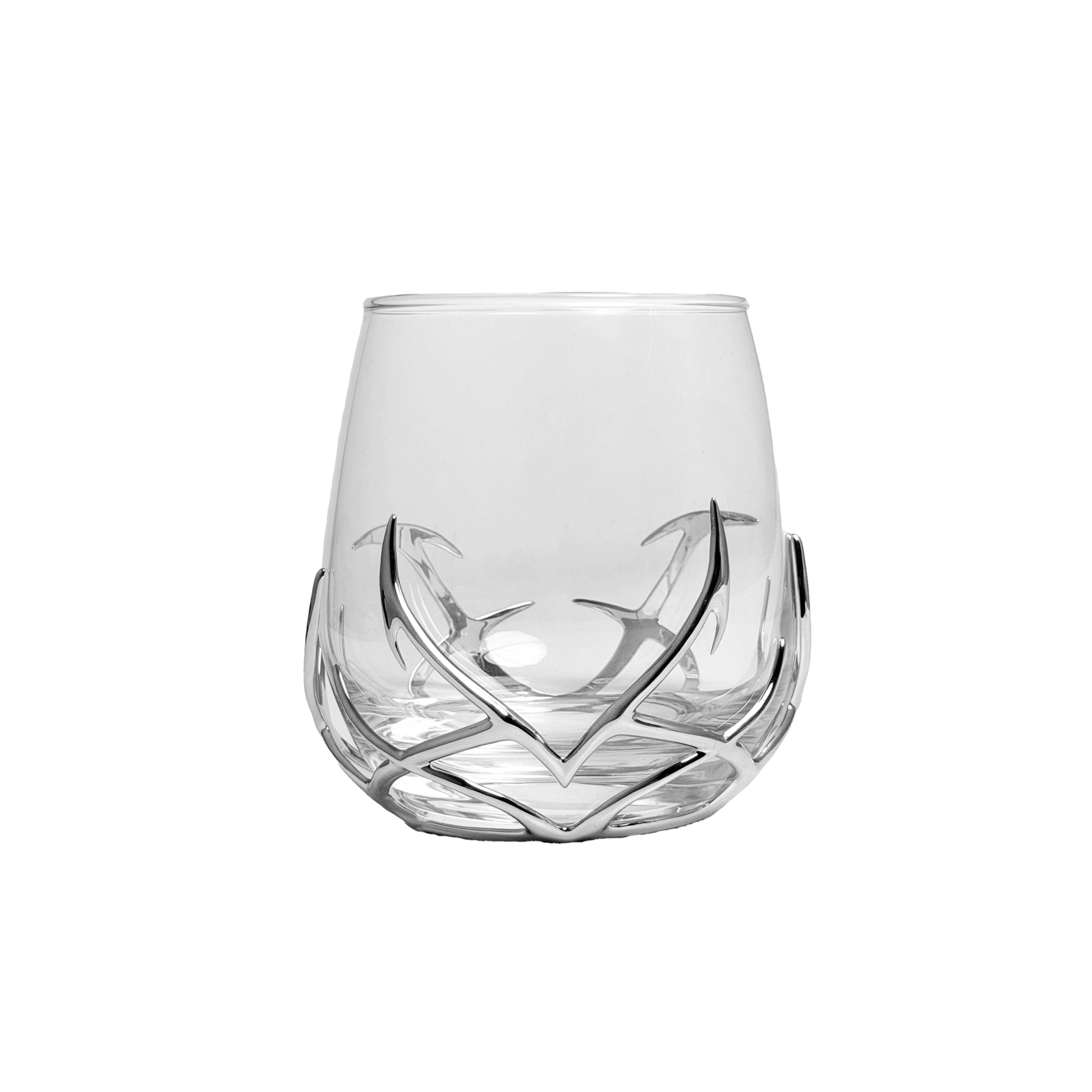 Clear glass tumbler with decorative base on a white background
