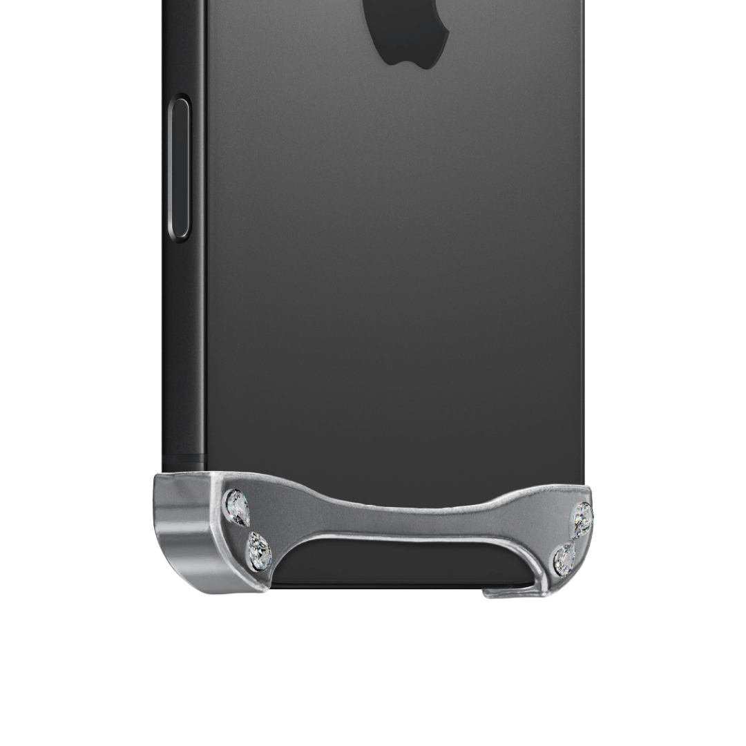 iPhone case with segmented silver chrome frame and embedded crystal studs, creating a minimalist, jewelry-inspired protective design.