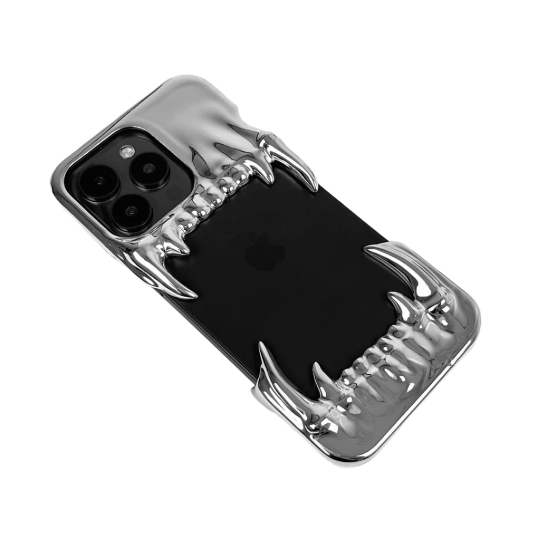 Metallic silver iPhone case with fierce dragon fang design – upper and lower jaws grip the phone edges, creating a bold, high-impact gothic aesthetic.