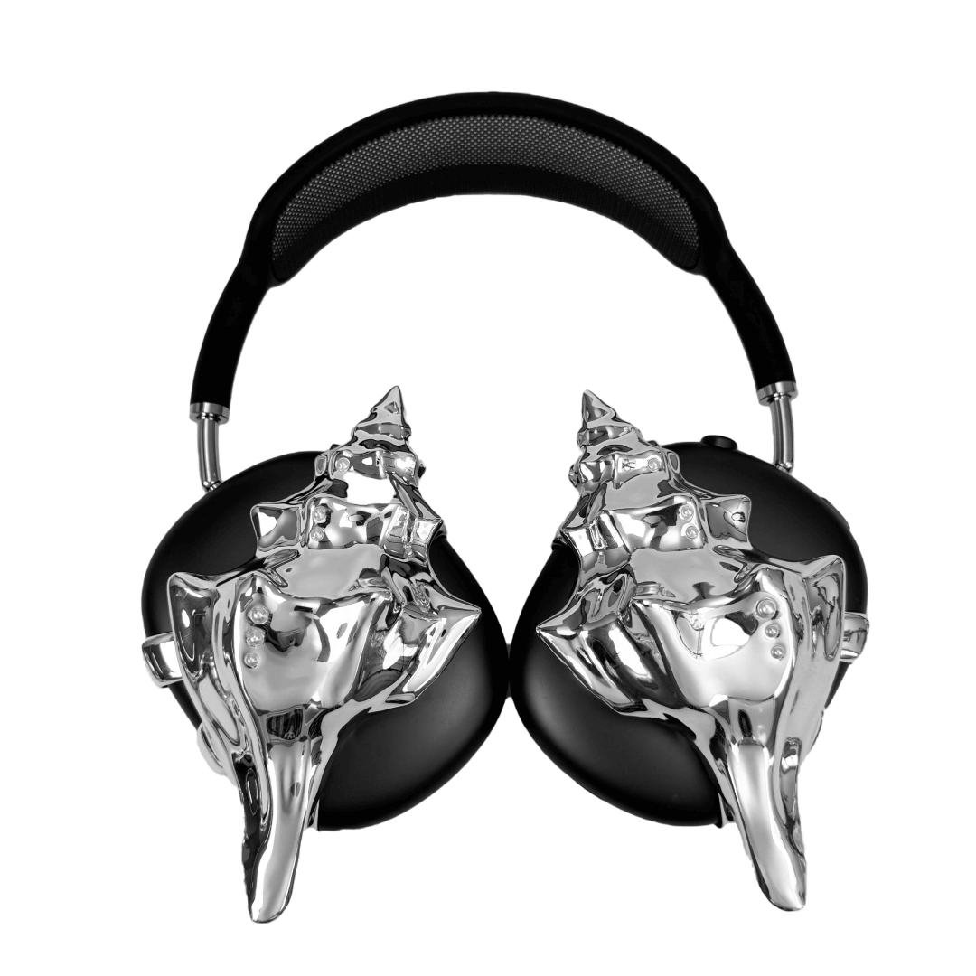 Over-ear headphones with sculptural conch shell embellishments and metallic accent dots, evoking deep-sea elegance and organic rhythm.
