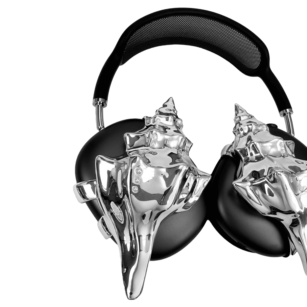 Over-ear headphones with sculptural conch shell embellishments and metallic accent dots, evoking deep-sea elegance and organic rhythm.