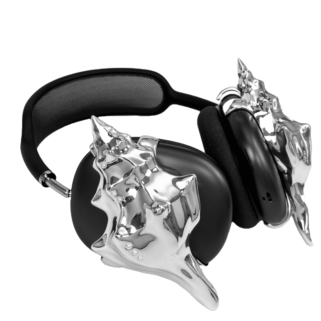 Over-ear headphones with sculptural conch shell embellishments and metallic accent dots, evoking deep-sea elegance and organic rhythm.