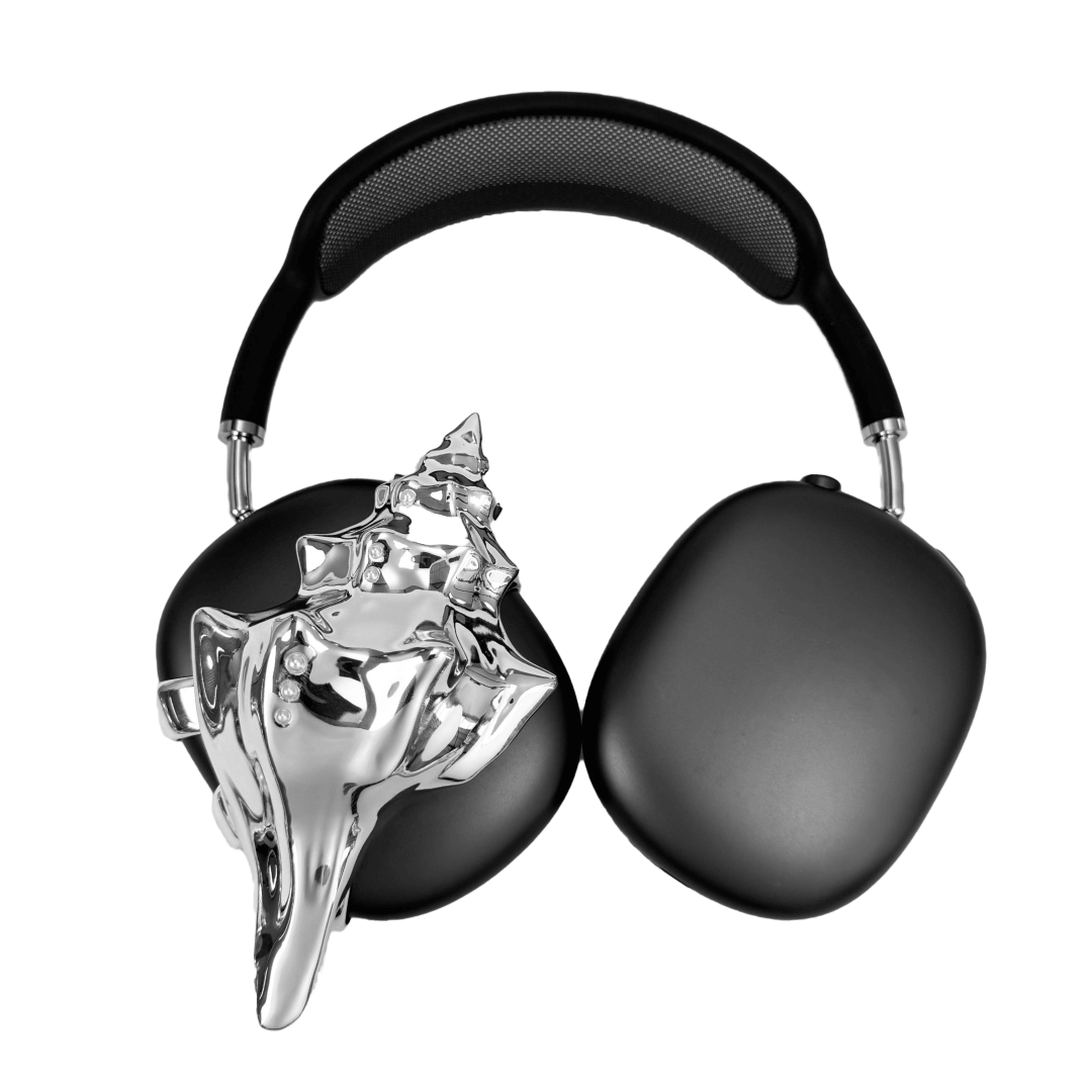 Over-ear headphones with sculptural conch shell embellishments and metallic accent dots, evoking deep-sea elegance and organic rhythm.