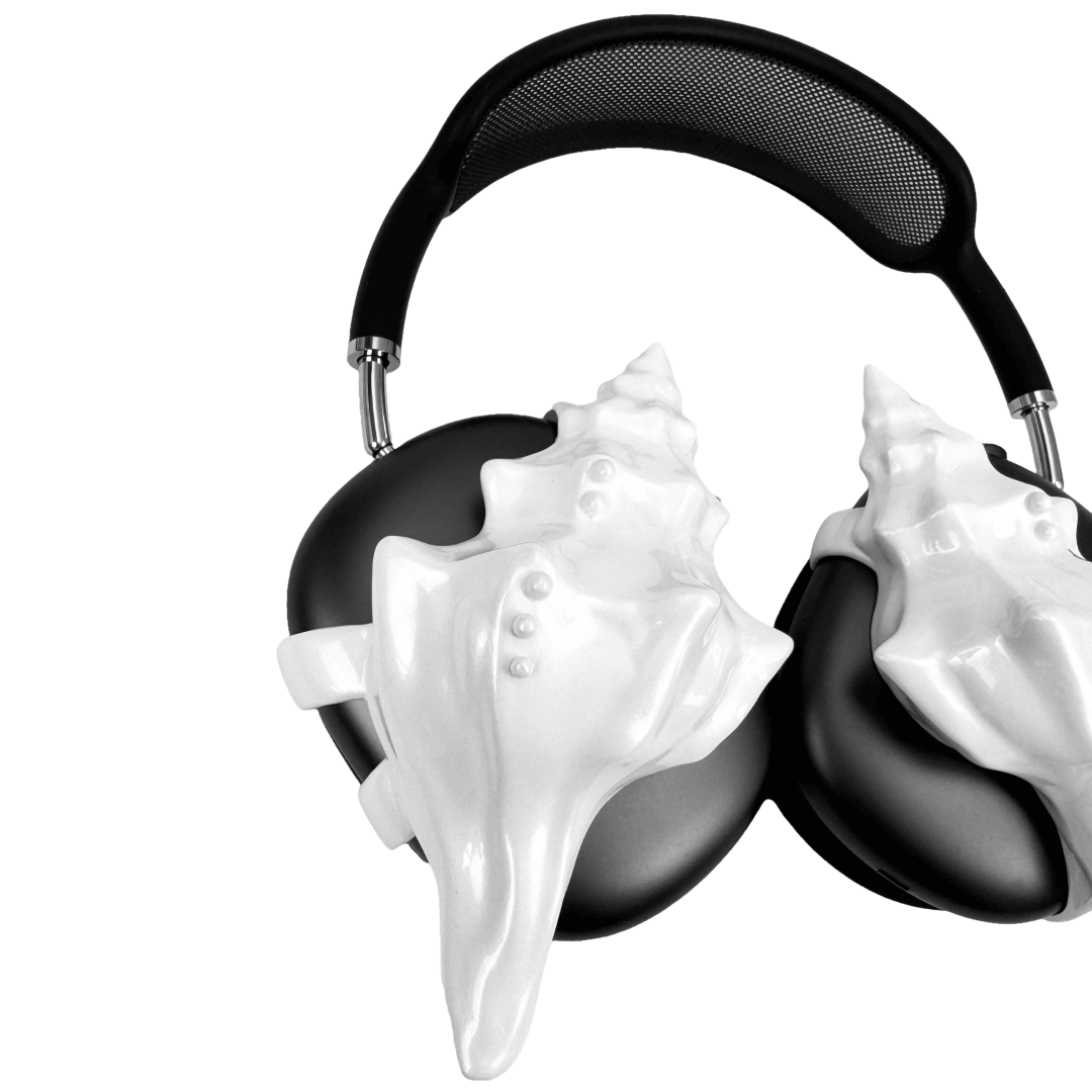 Over-ear headphones with sculptural conch shell embellishments and metallic accent dots, evoking deep-sea elegance and organic rhythm.