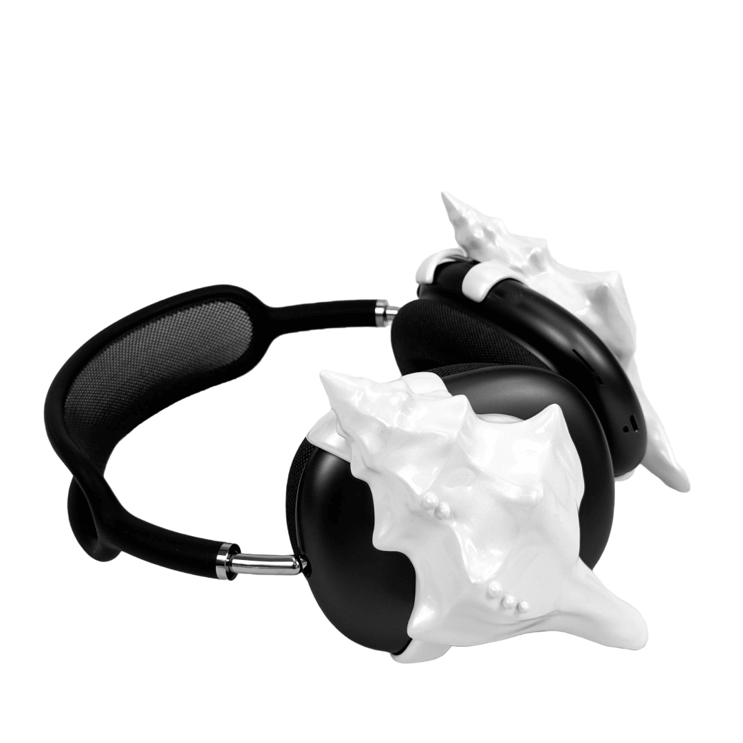 Over-ear headphones with sculptural conch shell embellishments and metallic accent dots, evoking deep-sea elegance and organic rhythm.