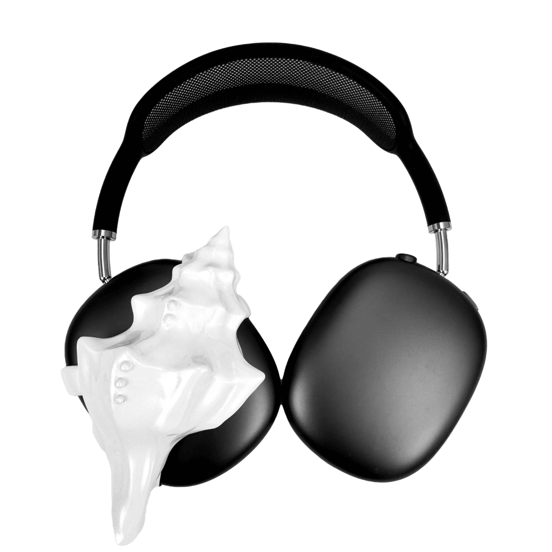 Over-ear headphones with sculptural conch shell embellishments and metallic accent dots, evoking deep-sea elegance and organic rhythm.
