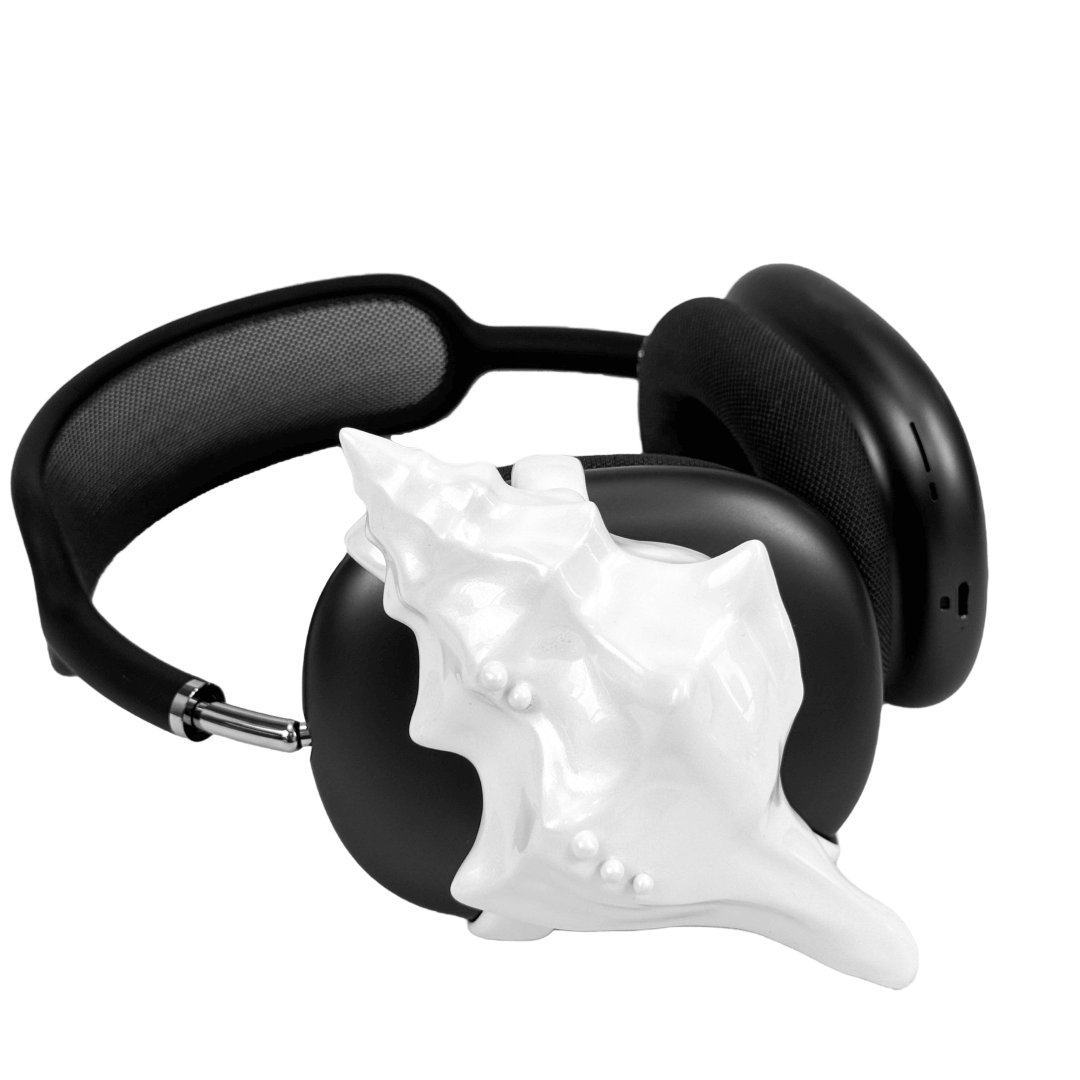 Over-ear headphones with sculptural conch shell embellishments and metallic accent dots, evoking deep-sea elegance and organic rhythm.