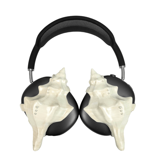 Over-ear headphones with sculptural conch shell embellishments and metallic accent dots, evoking deep-sea elegance and organic rhythm.Over-ear headphones with sculptural conch shell embellishments and metallic accent dots, evoking deep-sea elegance and organic rhythm.