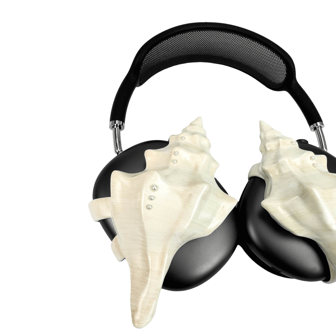 Over-ear headphones with sculptural conch shell embellishments and metallic accent dots, evoking deep-sea elegance and organic rhythm.