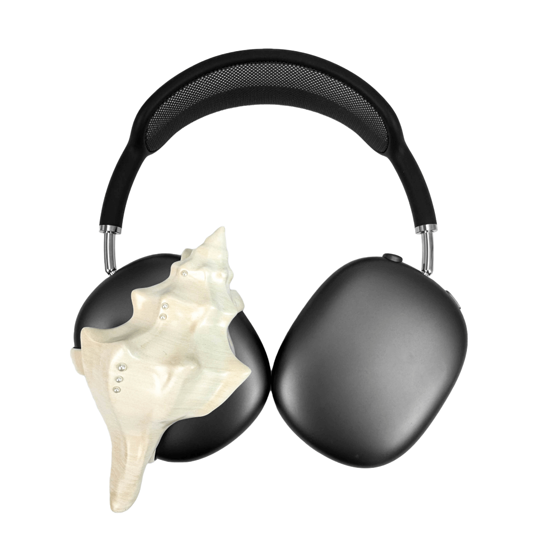 Over-ear headphones with sculptural conch shell embellishments and metallic accent dots, evoking deep-sea elegance and organic rhythm.