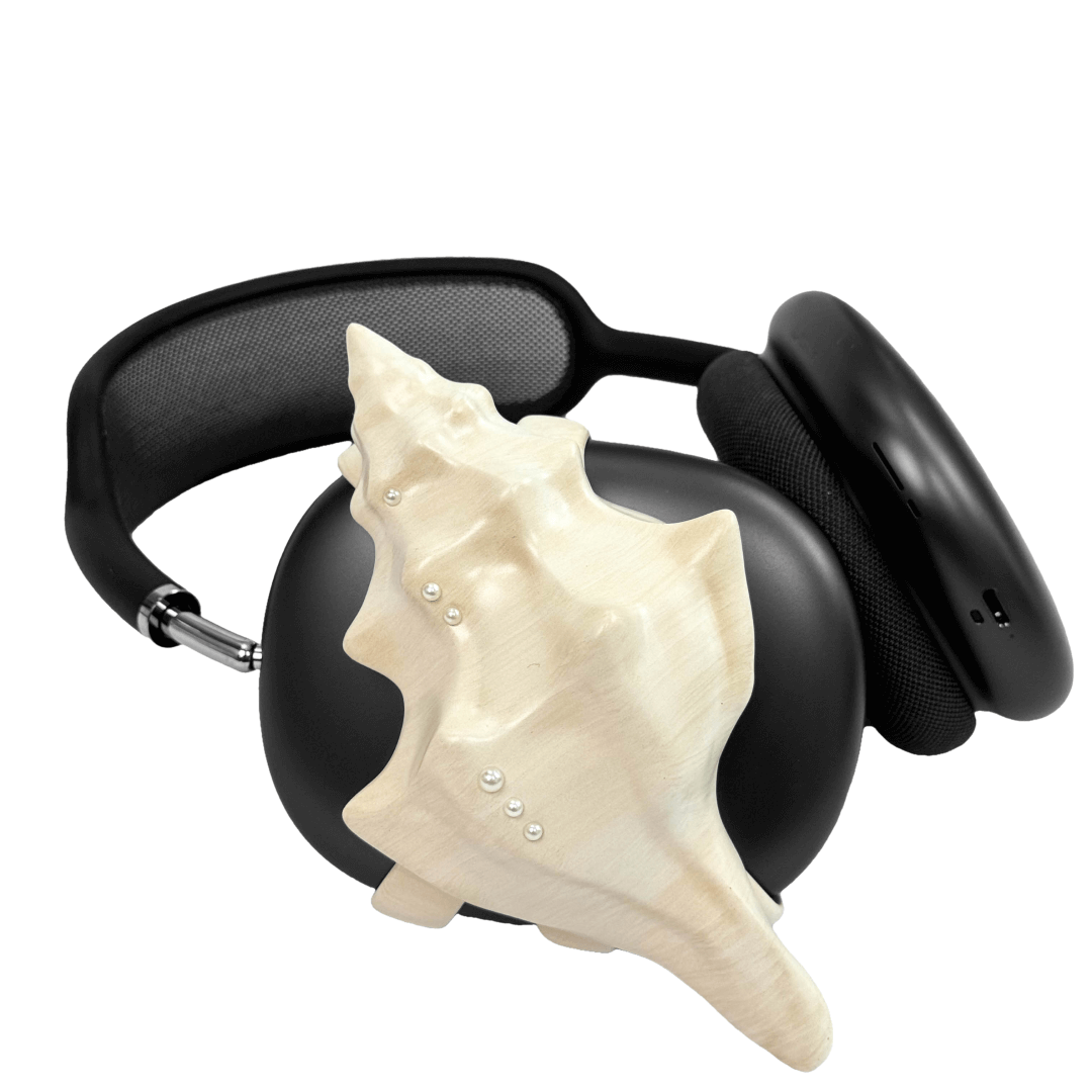 Over-ear headphones with sculptural conch shell embellishments and metallic accent dots, evoking deep-sea elegance and organic rhythm.