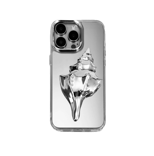 Metallic seashell-shaped phone case accessory with a sculpted, fluid spiral design and delicate pearl-like embellishments.