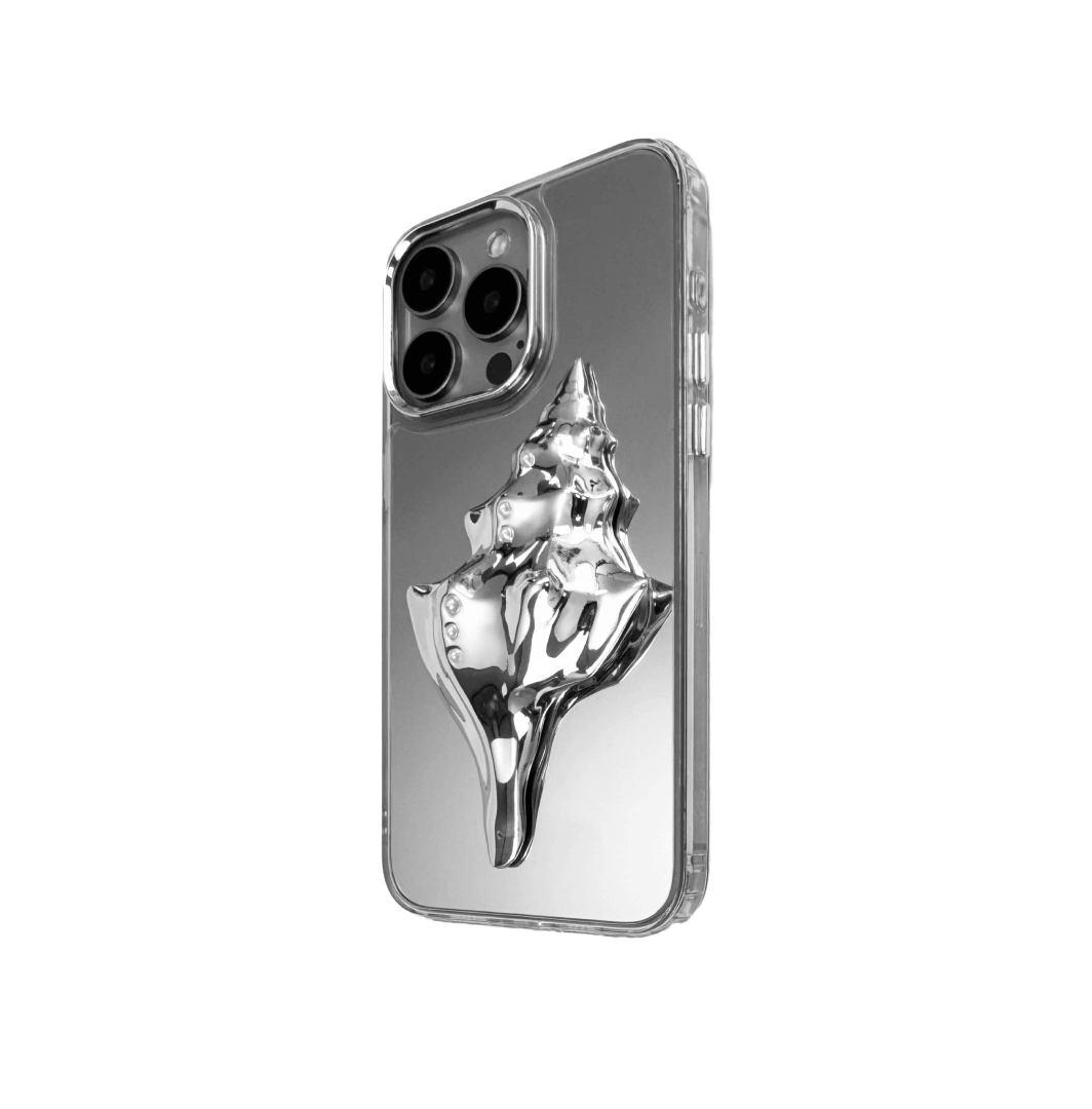 Metallic seashell-shaped phone case accessory with a sculpted, fluid spiral design and delicate pearl-like embellishments.