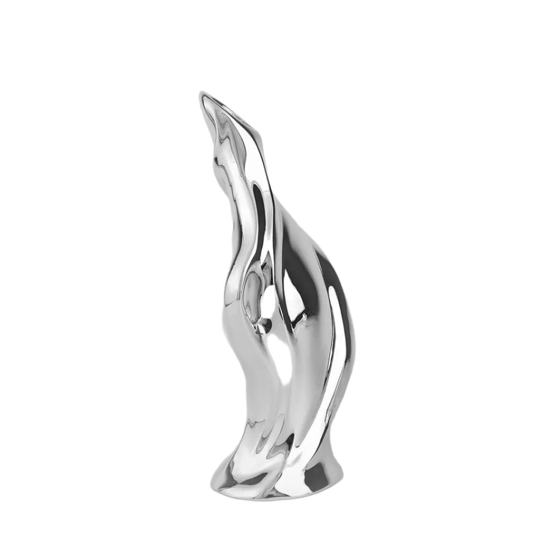 Futuristic silver vase with fluid sculptural form and blooming lily – sleek metallic design blending natural elegance and modern artistry