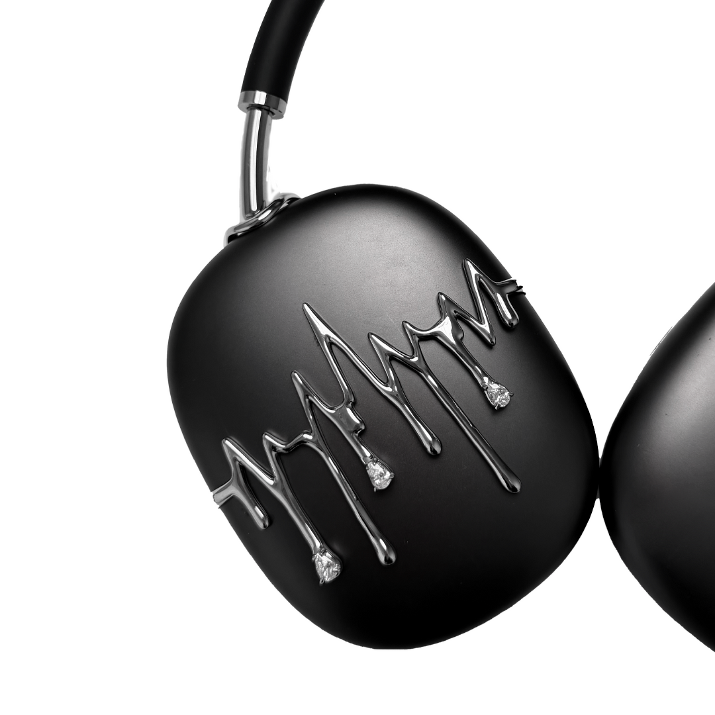 AirPods Max cover featuring silver chrome waveform patterns resembling musical pulses, with crystal-like droplets hanging from the lines, set against matte black earcups.