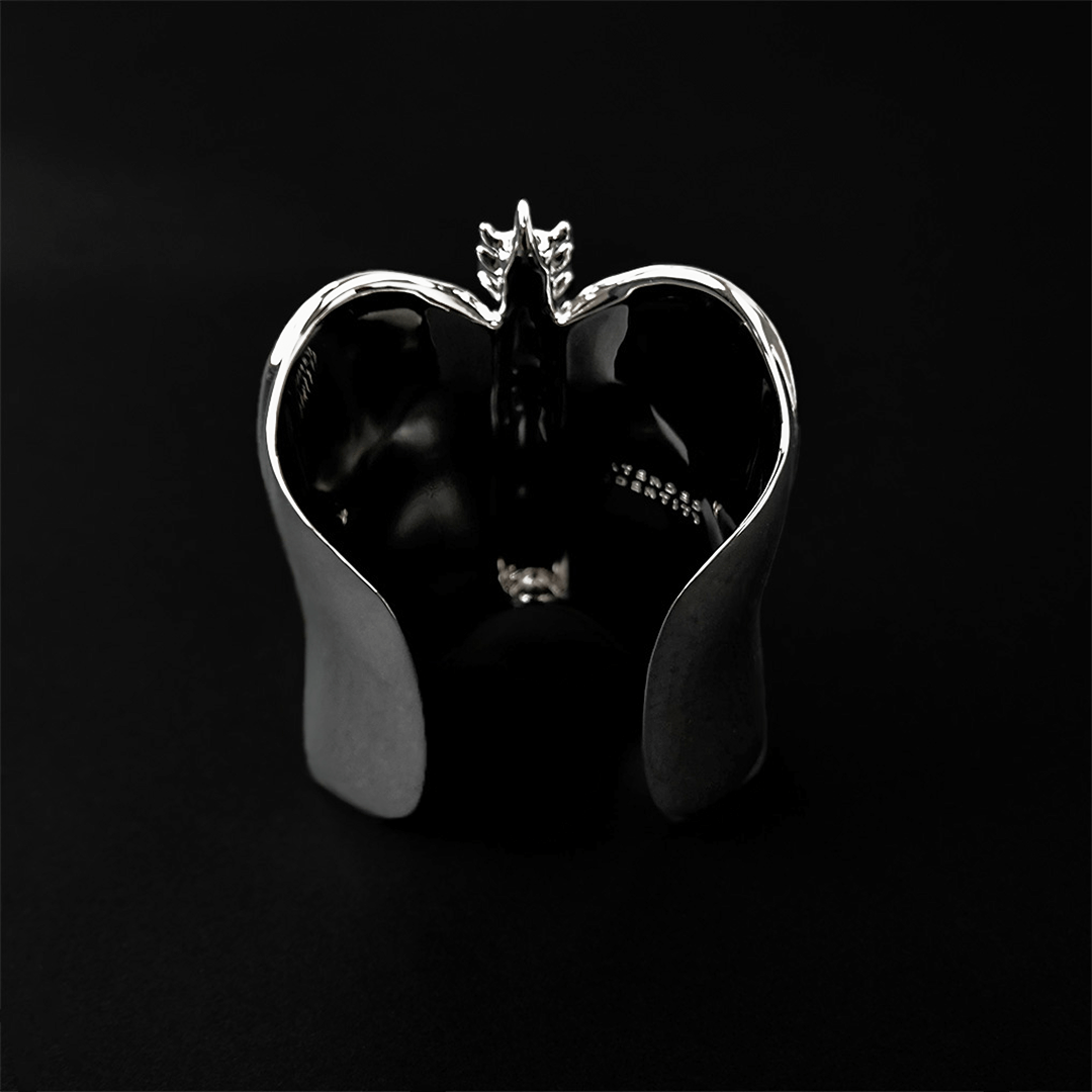 Command attention with the Gem Ribcage Cuff. Skeletal luxury meets couture gems in this red carpet-worthy arm piece.