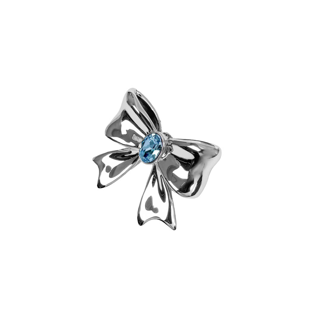 Add a touch of luxury with the Gem Bow Ring featuring a delicate bow design adorned with Swarovski crystals. A luxury ring that combines elegance and sparkle.