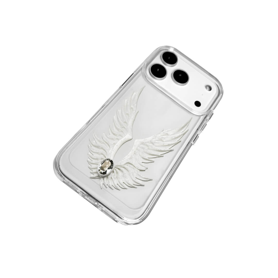 The Embroidered White Feather Wings iPhone Case featuring intricate white feather/wing embroidery and a central pearl, shown on both the Crystal Clear (Transparent) and White Leather Texture base options.