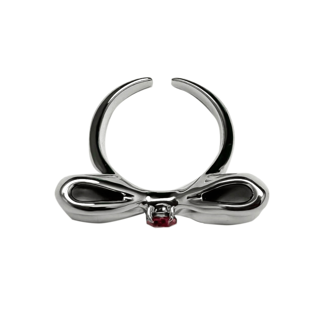 Elegant bow-shaped ring in silver and black with a pink Swarovski crystal at the center.